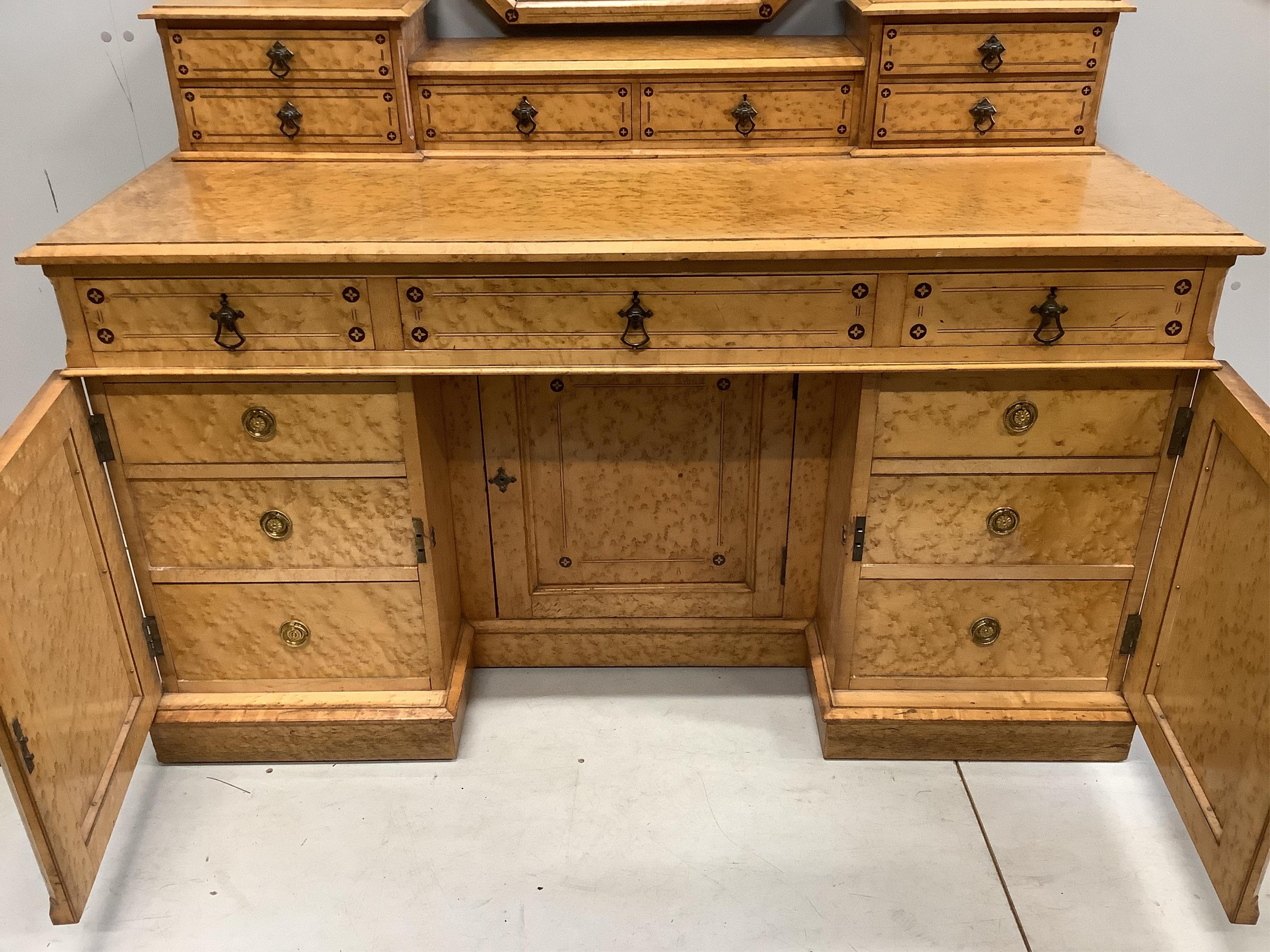 A late Victorian Gothic revival ebony inlaid, bird's eye maple bedroom suite, manner of Charles Bevan, comprising 5ft bed frame, kneehole dressing table, chest of drawers, marble top washstand, bedside cabinet, commode a